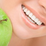 healthy teeth and green apple